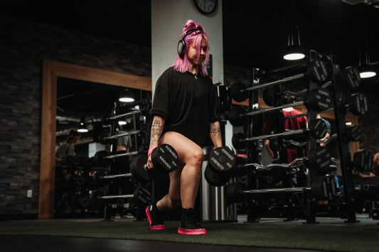 Leg day, woman doing a deep barbell squat